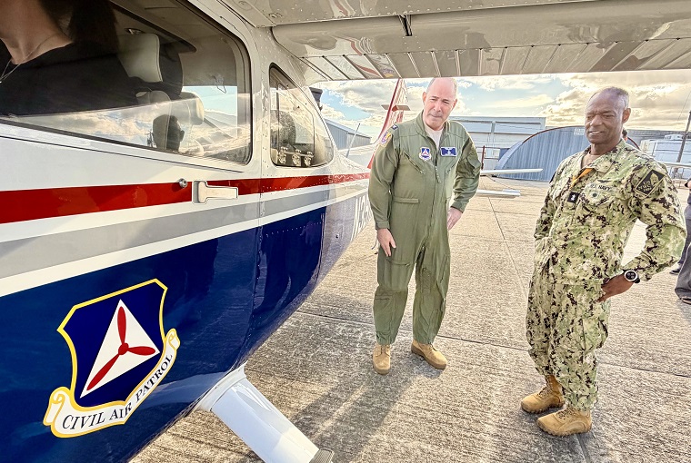 Two men looking at a plane